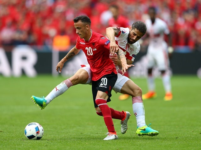 Ergys Kace of Albania and Ricardo Rodriguez of Switzerland compete for the ball in their Euro 2016 Group A match on June 11, 2016