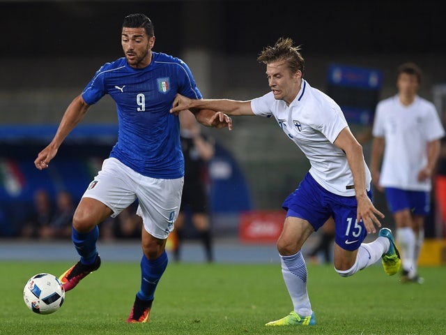 Graziano Pelle of Italy is challenged by Markus Halsti of Finland during the international friendly on June 6, 2016