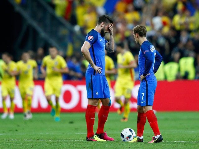 Olivier Giroud (L) and Antoine Griezmann (R) of France react after Romania's first goal during the UEFA Euro 2016 Group A match between France and Romania at Stade de France on June 10, 2016 in Paris, France
