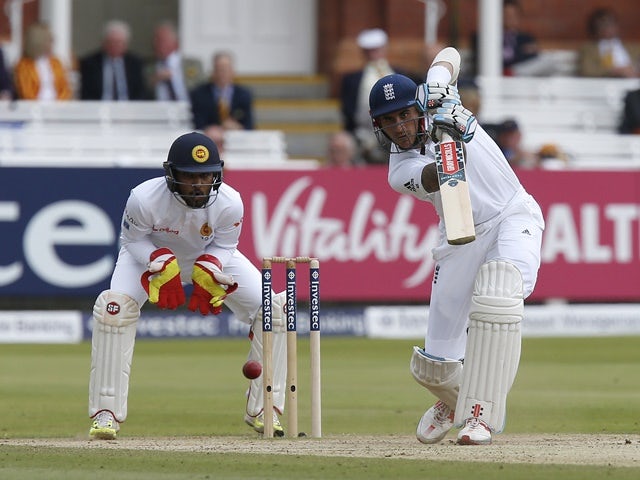 England's Alex Hales plays a shot watched by Sri Lanka's Dinesh Chandimal on the fourth day of the third Test on June 12, 2016