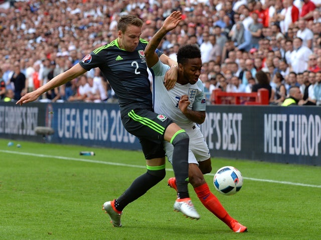 Chris Gunter and Raheem Sterling during the Euro 2016 Group B game between England and Wales on June 16, 2016