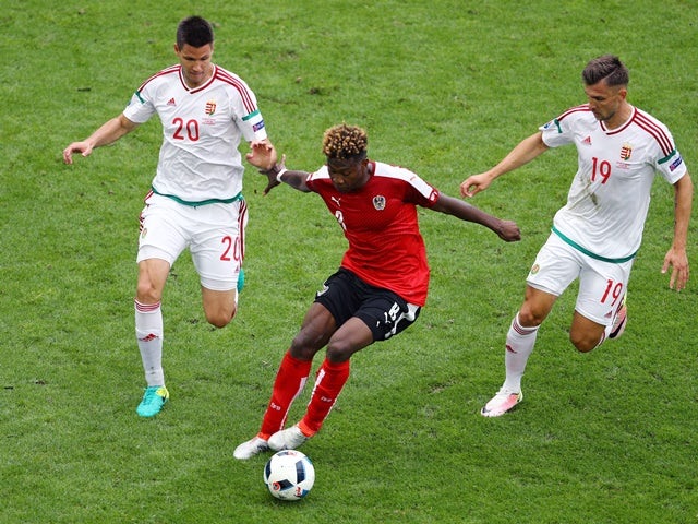 David Alaba, Richard Guzmics and Tamas Priskin in action during the Euro 2016 Group F game between Austria and Hungary on June 14, 2016