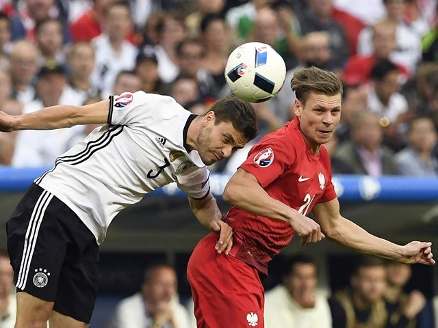 Jonas Hector and Lukasz Piszczek in action during the Euro 2016 Group C match between Germany and Poland on July 16, 2016