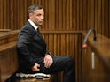 Oscar Pistorius sits inside the dock at the high court in Pretoria ahead of sentencing on June 13, 2016