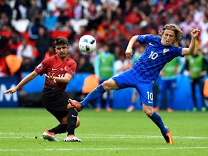 Ozan Tufan and Luka Modric during the Euro 2016 Group D game between Turkey and Croatia on June 12, 2016