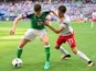 Northern Ireland's defender Paddy McNair controls the ball as Poland's Bartosz Kapustka marks him on June 12, 2016
