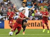 Sami Khedira fouls Arkadiusz Milik during the Euro 2016 Group C match between Germany and Poland on July 16, 2016