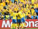 Sweden's players celebrate after Ireland scored an own goal during the Euro 2016 group E football match between Ireland and Sweden at the Stade de France stadium in Saint-Denis on June 13, 2016