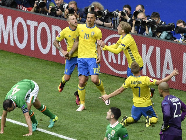 Sweden's forward Zlatan Ibrahimovic (C) celebrates with teammates after Ireland scored an own goal during the Euro 2016 group E football match between Ireland and Sweden at the Stade de France stadium in Saint-Denis on June 13, 2016