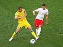 Andriy Yarmolenko and Arkadiusz Milik in action during the Euro 2016 Group C match between Ukraine and Poland on June 21, 2016