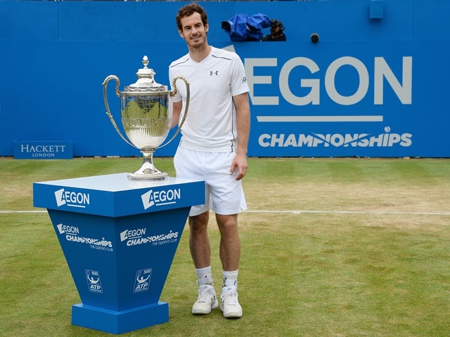 Andy Murray with the trophy after victory in the final against Milos Raonic at Queen's on June 19, 2016