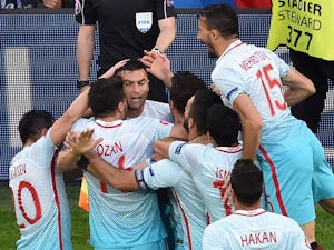 Turkey keep last-16 hopes alive with win