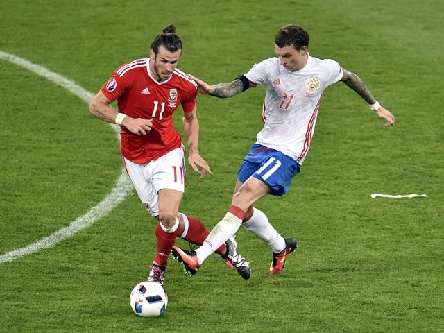 Gareth Bale and Pavel Mamaev in action during the Euro 2016 Group B match between Russia and Wales on June 20, 2016
