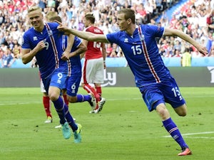 Iceland qualify for last-16 with late win