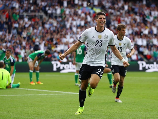 Mario Gomez celebrates scoring the opening goal during the Euro 2016 Group C match between Northern Ireland and Germany on June 21, 2016