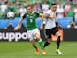 Steven Davis and Mesut Ozil in action during the Euro 2016 Group C match between Northern Ireland and Germany on June 21, 2016