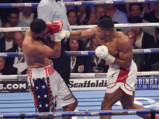 Anthony Joshua and Dominic Breazeale during their bout for the IBF world heavyweight title at the O2 Arena on June 25, 2016