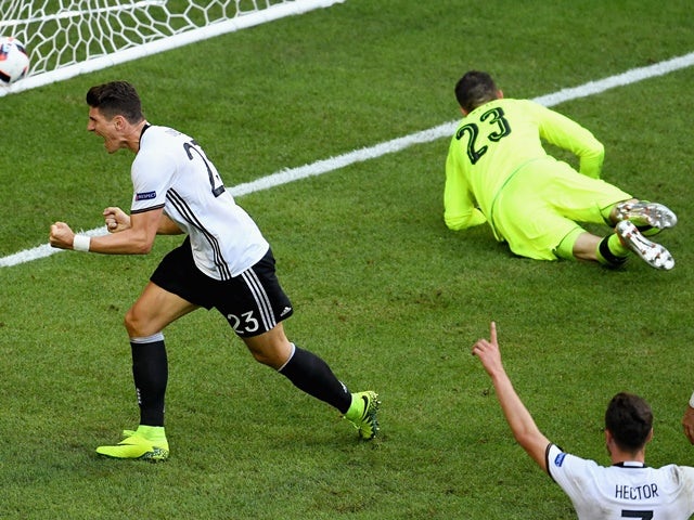 Mario Gomez celebrates scoring his side's second goal during the Euro 2016 RO16 match between Germany and Slovakia on June 26, 2016