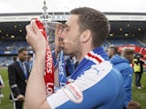 Nicky Clark lifts the Scottish Championship Trophy after the match between Rangers and Alloa Athletic at Ibrox Stadium on April 23, 2016