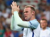 Wayne Rooney of England applauds the supporters after his team's 1-2 defeat in the UEFA EURO 2016 round of 16 match between England and Iceland at Allianz Riviera Stadium on June 27, 2016 in Nice, France