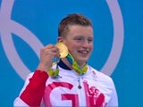 Adam Peaty holds his gold medal after the 100m breaststroke at the Rio Olympics on August 7, 2016