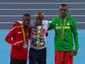 Mo Farah poses with his gold medal after the men's 10,000m at the Rio Olympics on August 13, 2016