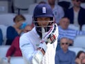 Moeen Ali reacts after being hit on the head during day one of the fourth Test between England and Pakistan on August 11, 2016