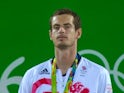 A jubilant Andy Murray collects his gold medal on August 14, 2016