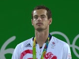 A jubilant Andy Murray collects his gold medal on August 14, 2016