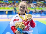 Ellie Robinson celebrates with her gold medal earned in the women's 50m butterfly S6 at the Paralympic Games in Rio on September 9, 2016