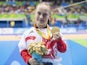 Ellie Robinson celebrates with her gold medal earned in the women's 50m butterfly S6 at the Paralympic Games in Rio on September 9, 2016