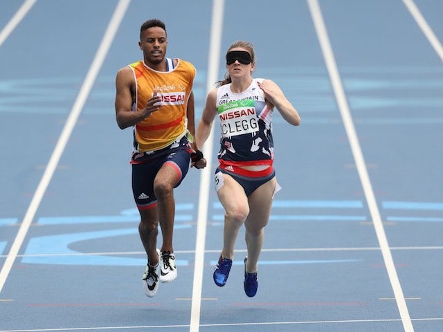 Libby Clegg and guide Chris Clarke in action for Paralympics GB during the women's T11 100m event at the Rio Games on September 9, 2016