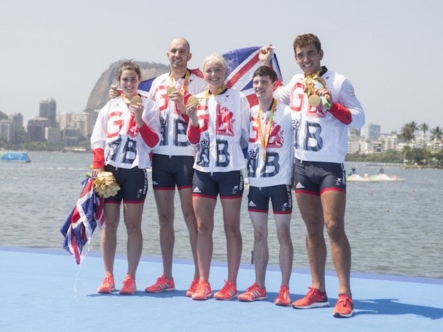 ParalympicsGB's LTA mixed coxed four team celebrate with their gold medal on September 11, 2016