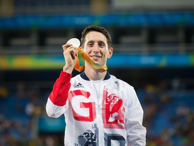 Jonathan Broom-Edwards celebrates with his silver medal earned in the men's high jump T44 at the Paralympic Games in Rio de Janeiro on September 12, 2016