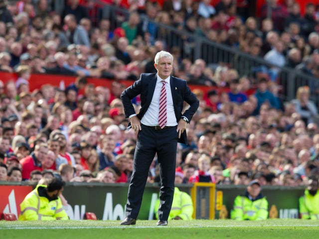 Stoke City manager Mark Hughes watches on during his side's Premier League clash with Manchester United at Old Trafford on October 2, 2016