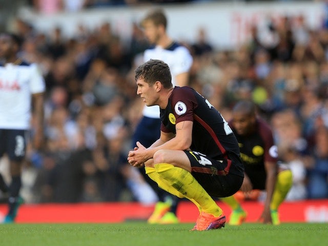 John Stones looks dejected during the Premier League match between Tottenham Hotspur and Manchester City on October 2, 2016