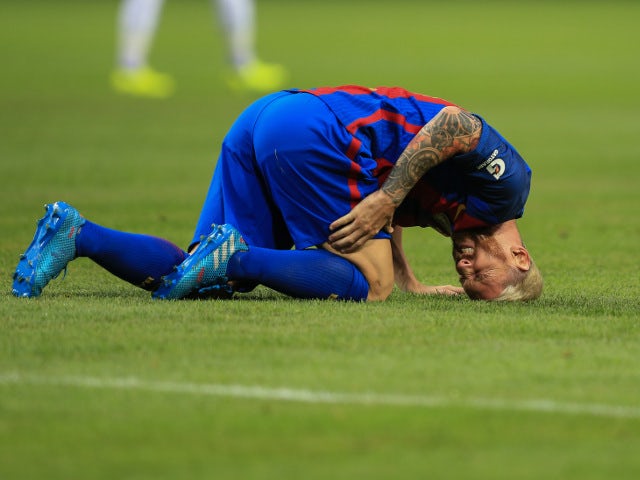 Barcelona forward Lionel Messi goes down injured during a pre-season friendly in Stockholm on August 3, 2016