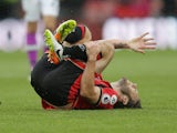 Bournemouth midfielder Harry Arter goes down injured during his side's Premier League clash with Hull City at the Vitality Stadium on October 15, 2016