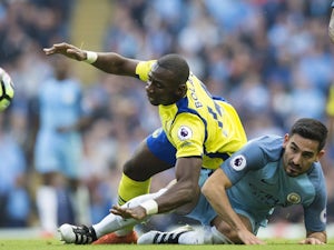 Manchester City midfielder Ilkay Gundogan  fights for the ball against Everton midfielder Yannick Bolasie on October 15, 2016