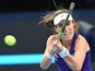 Johanna Konta of Britain hits a return to Agnieszka Radwanska of Poland at the China Open on October 9, 2016