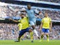 Kelechi Iheanacho attempts to score with a backheel despite the attentions of Everton defender Ashley Williams on October 15, 2016