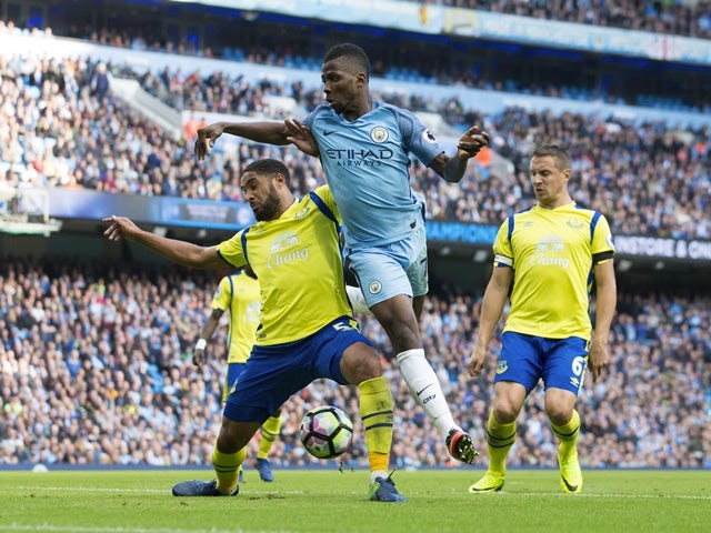 Kelechi Iheanacho attempts to score with a backheel despite the attentions of Everton defender Ashley Williams on October 15, 2016