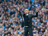 Manchester City manager Pep Guardiola gestures during his side's Premier League match against Everton at the Etihad Stadium on October 15, 2016