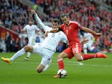 Georgia's Solomon Kvirkvelia dives in to tackle Wales's Gareth Bale during the 2018 World Cup Qualifier match on 9 October 2016