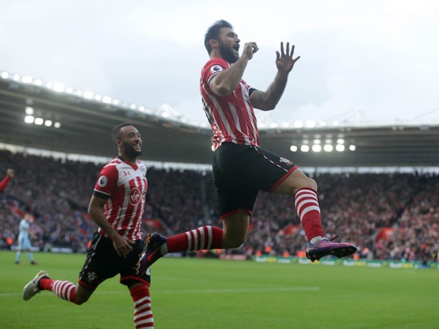 Charlie Austin celebrates making it 1-0 with Nathan Redmond against Burnley at St Mary's Stadium on October 16, 2016
