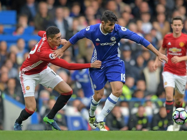 Chris Smalling mistimes his grab of Diego Costa's crotch during the Premier League game between Chelsea and Manchester United on October 23, 2016