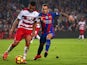 Barcelona's Paco Alcacer challenges Ruben Vezo of Granada during the La Liga clash at the Camp Nou on October 29, 2016