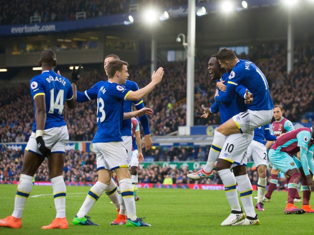 Everton striker Romelu Lukaku celebrates with teammates after scoring in their Premier League clash with West Ham United at Goodison Park on October 30, 2016
