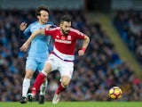 Middlesbrough striker Alvaro Negredo fends off the challenge of compatriot and former teammate David Silva during the Premier League clash with Manchester City at the Etihad Stadium on November 5, 2016