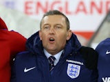 Interim England Under-21s manager Aidy Boothroyd sings the national anthem before his side's friendly against Italy Under-21s at St Mary's Stadium on November 10, 2016